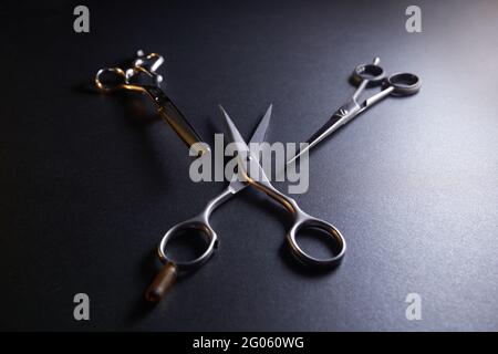 japanese professional hairdressers thinning scissors on black background. Beauty salon equipment. Stylish Professional Barber, Haircut accessories Stock Photo