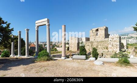 Roman colonnade and Byblos citadel, Crusader castle, Jbeil, Lebanon Stock Photo