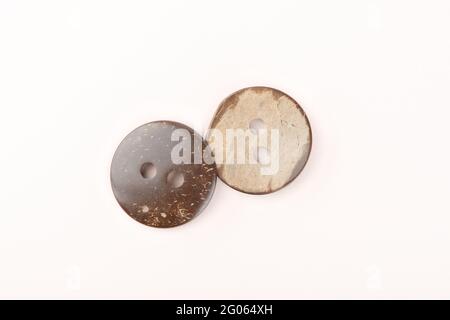 Two brown marbled plastic buttons on both sides. Close up. Copy space. Stock Photo