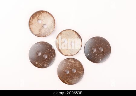Several brown marbled plastic buttons on both sides. Top view. Stock Photo