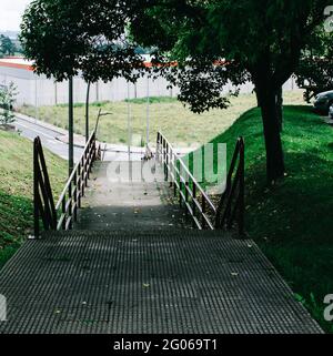 Stairs with red railing in the park Stock Photo