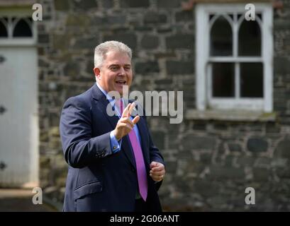 Secretary of State for Northern Ireland Brandon Lewis speaks to members of the media during the announcement that the County Down village of Hillsborough, home to the Queen's official residence in Northern Ireland, is to become the first town or village in the region to be given a Royal prefix. Issue date: Tuesday June 1, 2021. Stock Photo