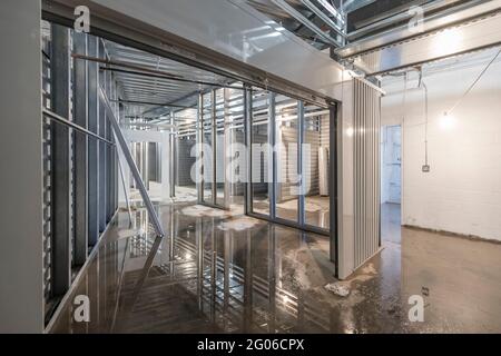 Commercial property interior under construction with metal studs, Philadelphia Pennsylvania USA Stock Photo