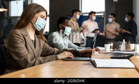 Colleagues having meeting in boardroom, working on a project Stock Photo