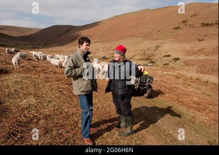 Rory Stewart, the Conservative parliamentary candidate for the Penrith and the Border’s constituency, speaking with farmer Jane Barker, during his 2010 general election campaign. Dalefoot, Heltondale, Cumbria, UK.  16 Apr 2010 Stock Photo