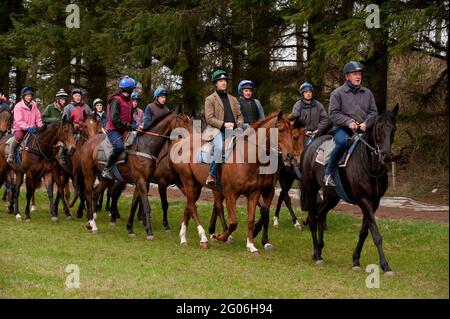 Rory Stewart (Green tartan hat cover and tweed jacket), the Conservative parliamentary candidate for the Penrith and the Border’s constituency, riding out with staff from the  Greystoke Stables, during his 2010 general election campaign.  Greystoke Stables, Greystoke, Cumbria, UK.  16 Apr 2010 Stock Photo