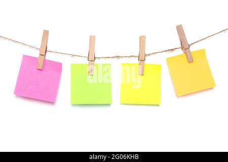 Note pad in many colors, hang with rope, have clothes peg, copy space for letters and texts on white background Stock Photo