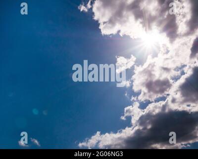 Sun rays coming out of the clouds Stock Photo