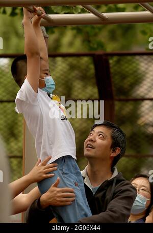 Beijing, China. 01st June, 2021. Children play in a public exercise area in Beijing on Tuesday, June 1, 2021. China says it will allow couples to have three children, up from two, as the Communist Party attempts to reverse declining birthrates and aver a population crisis, but experts say it is woefully inadequate. Photo by Stephen Shaver/UPI Credit: UPI/Alamy Live News Stock Photo