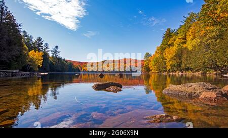 Beautiful fall colours around a calm lake Stock Photo