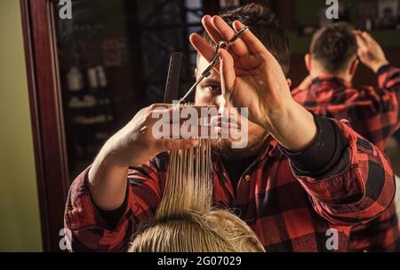 Healthy hair. Professional cosmetics. Annoy barber could turn out poorly for your ear. Donation and charity concept. Guy with dyed hair. Cut hair Stock Photo