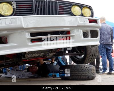 A white BMW being prepared for the race during the event.Festival Drift Expo Track Mode runs on May 29-30 at ADM Raceway with the exhibition of projects modified for drifting such as; ‘Drift Taxi’ - an opportunity to ride as a passenger with a professional driver in a specially prepared sports car on the race track, ‘Drift Trike Area’ - a platform where you can try driving a real drift trike and ‘RC Drift’ - drift on radio controlled cars. Stock Photo