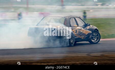 A turning black and orange car seen during the event.Festival Drift Expo  Track Mode runs on May 29-30 at ADM Raceway with the exhibition of projects  modified for drifting such as; 'Drift