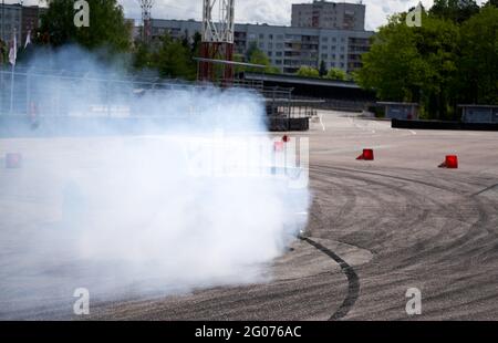 Race car drifting on speed track, Professional driver drifting car on race track with smoke, Abstract texture and background black tire tracks skid on Stock Photo