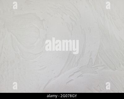 Close up of beige painted wall with stucco swirl pattern Stock Photo
