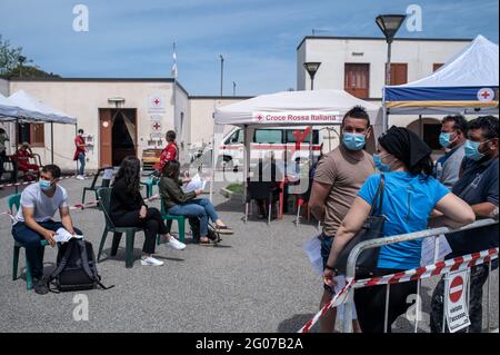 Vulcano, Sicily, Italy. 14th May, 2021. People wait from the anamnesis point to receive their vaccine shots during the mass vaccination.Mass vaccination started in Vulcano island under the guidance of Sicilia Region team, the Special Commissioner for Covid-19 Emergency for Messina Metropolitan Area (Ufficio Commissario Ad Acta per l'Emergenza Covid-19 per l'Area Metropolitana di Messina) and the Red Cross local team. Doses of Moderna and Johnson & Johnson vaccines were administered to residents in order to implement the 'Covid-free islands'' program for the summer. (Credit Image: © Valer Stock Photo