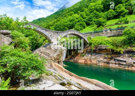 View of Bridge Ponte dei Salti to Verzasca River at Lavertezzo - clear and turquoise water stream and rocks in Ticino - Valle Verzasca - Valley in Tes Stock Photo