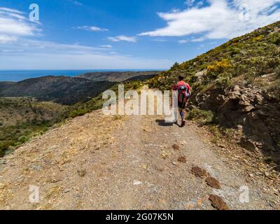 Hiking holiday along the Spanish Costa Brava coastal path, also known as the GR92 Cami de Ronda, going from Roses to Port de la Selva Stock Photo