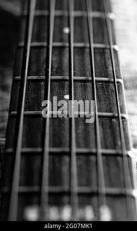 Grayscale close up shot of a guitar strings Stock Photo
