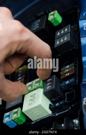 replacing the fuse in fuse box of the car Stock Photo - Alamy