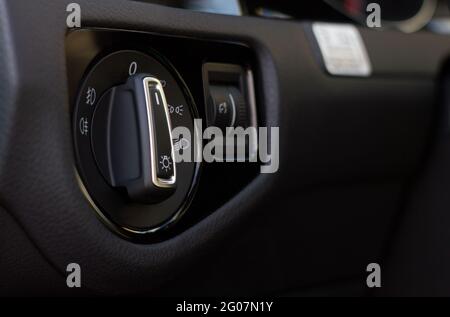 Modern car interior details with light control switch Stock Photo