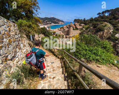 Hiking along the Spanish Costa Brava coastal path, also known as the GR92 Cami de Ronda, passing through Tossa de Mar Stock Photo