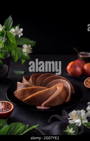 Dessert made from sanguine in a spiral shape on the table in a decorative way Stock Photo