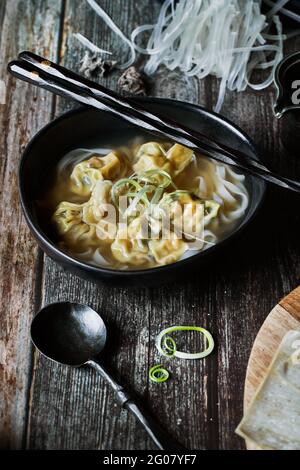 From above wonton soup on a wooden table Stock Photo