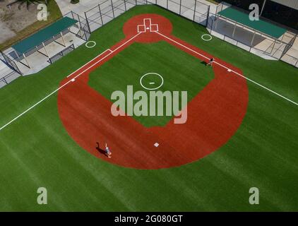 Palm Beach Gardens, Florida, USA. 8th July, 2020. Ballplayers play catch on a new practice field next to a regulation-sized baseball at Gardens Park in Palm Beach Gardens. Credit: Greg Lovett/Palm Beach Post/ZUMA Wire/Alamy Live News Stock Photo