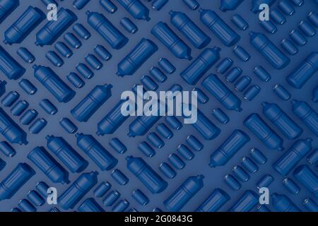 Background of plastic bottles and blue cans on blue background Stock Photo