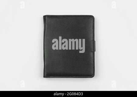 Black leather notepad on grey office table mockup with place for your text Stock Photo