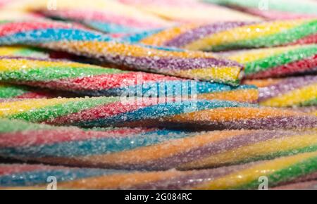 Multicolored jelly stick candies textured background Stock Photo