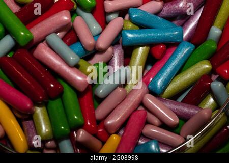 Multicolored jelly stick candies textured background Stock Photo