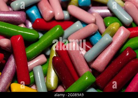 Multicolored jelly stick candies textured background Stock Photo