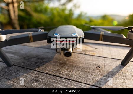 Close up shot of DJI Mavic Pro drone with eyes and teeth during sunset Stock Photo