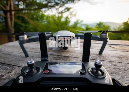 DJI Mavic Pro controller with the drone in the background Stock Photo
