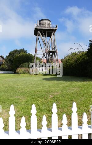 Mendocino water tower behind a white picket fence Stock Photo