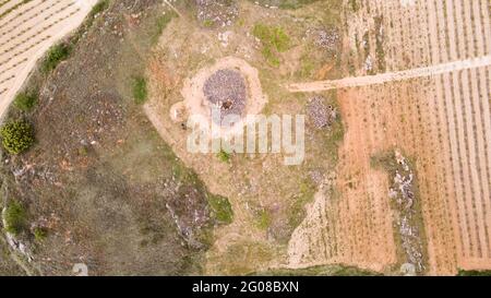 Aerial view of dolmens, collective funeral monuments comprising a chamber delimited by great stone slabs or megaliths and covered by a mound of earth Stock Photo