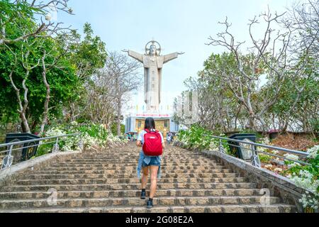Statue of Jesus Christ standing on Tao Phung mountain attracts pilgrims to visit and worship, the most popular local place in Vung Tau, Vietnam Stock Photo