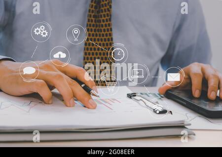 Business document graph and chart paperwork on desk.networking connection on virtual screen, Business technology concept Stock Photo