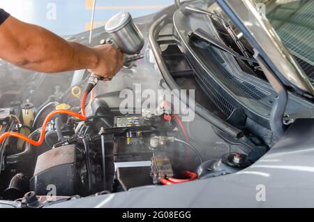 Clean the engine after washing the engine. Spraying the engine room varnish Stock Photo