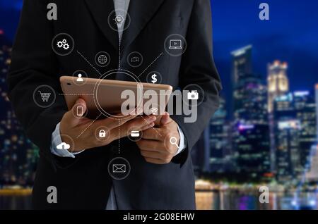 Businessman hand working with tablet digital marketing graph business shopping online concept media in virtual icon at office Stock Photo