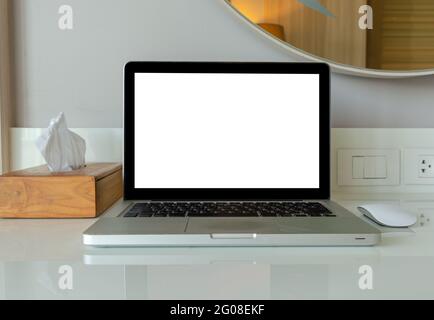 computer laptop mock up and mouse white blank screen for advertising text on table. Stock Photo
