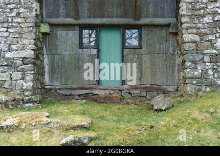 Teal door and unusual stone and wood architectural details, at the historic Massanutten Lodge in Shenandoah National Park Stock Photo