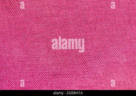 Close-up of red textile texture, red fabric for background and wallpaper. Stock Photo