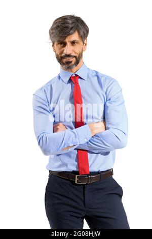 Confident stylish man in his 50s with folded arms standing smiling at the camera in a three-quarter frontal portrait on white Stock Photo