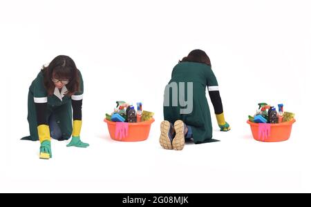 front and back view of a same Woman scrubbing the floor on her knees isolated on white Stock Photo
