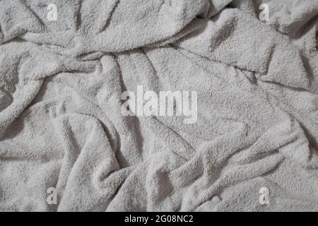 Crumpled white towel texture background Stock Photo