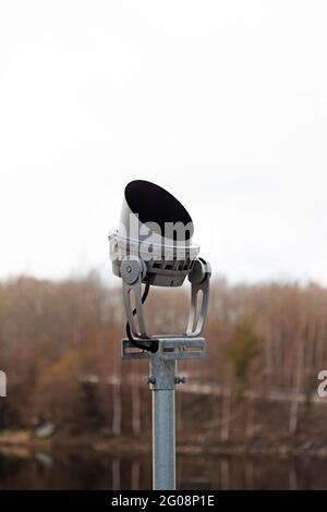 modern headlight seen from the side with trees in the background Stock Photo
