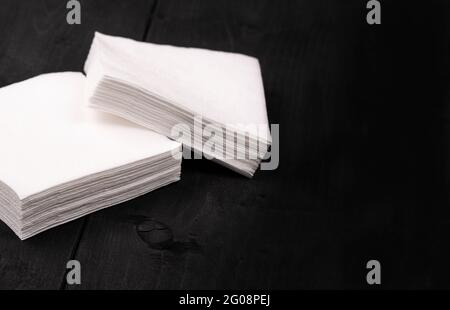 The white paper napkins on wooden background Close up Stock Photo